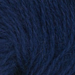 Close up on ball of navy blue Plymouth Angora yarn. 