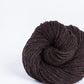 Dark brown ball of Brooklyn Tweed Loft yarn. 