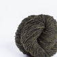 Dark moss green ball of Brooklyn Tweed Loft yarn. 