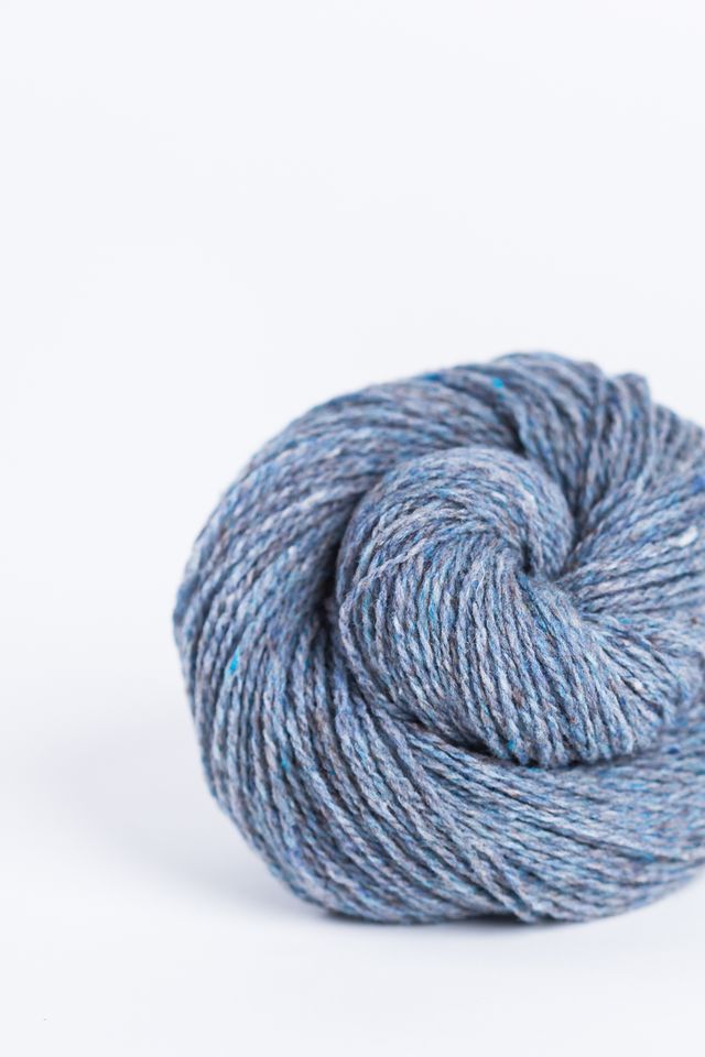 Light denim blue ball of Brooklyn Tweed Loft yarn. 