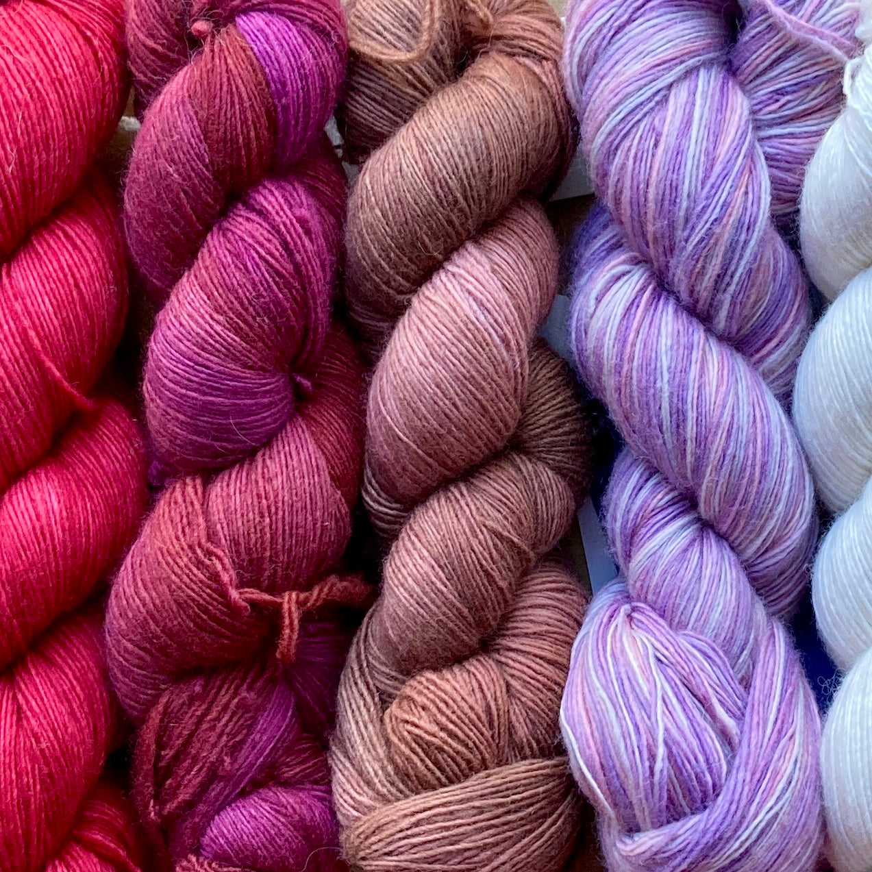 Close up on colorful skeins of Malabrigo Lace yarn. 