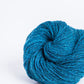 Turquoise ball of Brooklyn Tweed Loft yarn. 