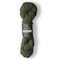 Skein of dark heathered green Isager Alpaca 2 yarn in color forest. 