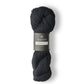 Skein of dark blue Isager Alpaca 2 yarn in color midnight. 