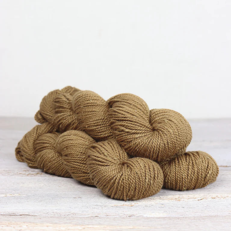 3 skeins of ochre Fibre Co. Acadia yarn. 