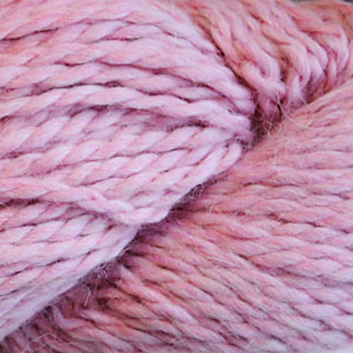 Close up on a skein of light pink Cascade Baby Alpaca Chunky yarn. 