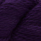 Close up on a skein of royal purple Cascade Baby Alpaca Chunky yarn. 