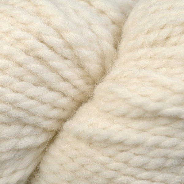 Close up on skein of Berroco Ultra Alpaca Chunky yarn in 7201 winter white. 