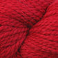 Close up on skein of Berroco Ultra Alpaca Chunky yarn in 7234 Cardinal red. 