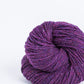 Purple ball of Brooklyn Tweed Loft yarn. 