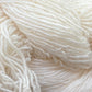 Close up on a bright white skein of Briggs & Little Sport yarn. 