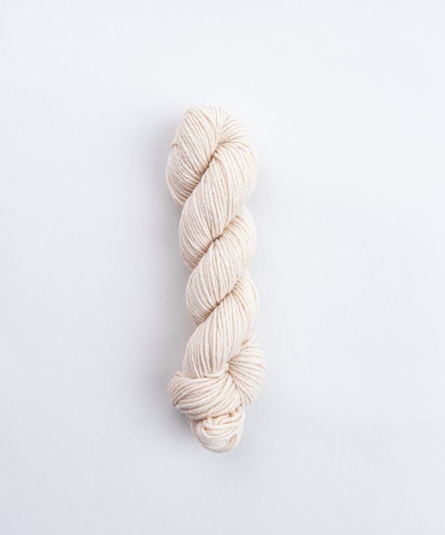 Skein of ivory Brooklyn Tweed Imbue Worsted yarn. 