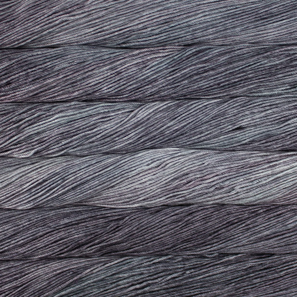 Skein of semisolid gray Malabrigo Caprino yarn. 