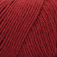 Close up on a dark red skein of Brown Sheep Cotton Fleece yarn. 