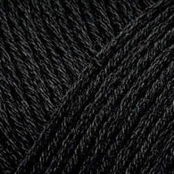 Close up on a black skein of Brown Sheep Cotton Fleece yarn. 