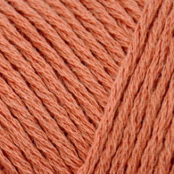 Close up on a terracotta skein of Brown Sheep Cotton Fleece yarn. 