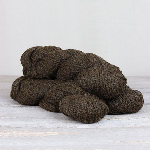 3 skeins of dark brown Fibre Co. Cumbria yarn. 