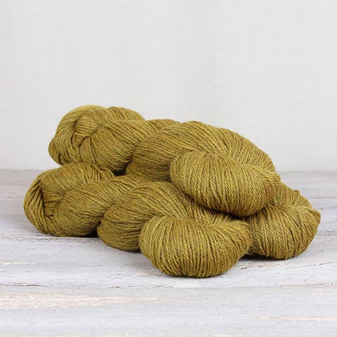 3 skeins of mustard yellow Fibre Co. Cumbria yarn. 