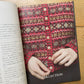 Yuco Sakamoto’s My Fair Isle Journey book, lying open to a photo of people wearing colorful fair isle garments. 