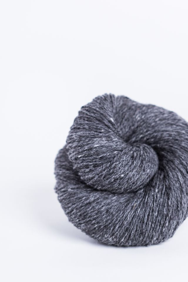 Dark gray ball of Brooklyn Tweed Loft yarn. 