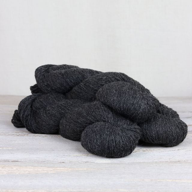 3 skeins of dark charcoal Fibre Co. Cumbria yarn. 