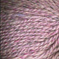 Close up on a light pink tweed ball of Queensland Kathmandu Aran yarn. 