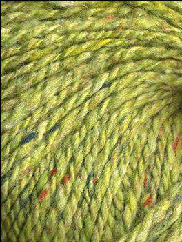 Close up on a grass green tweed ball of Queensland Kathmandu Aran yarn. 