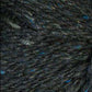 Close up on a dark indigo tweed ball of Queensland Kathmandu Aran yarn. 