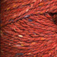 Close up on a dark rust tweed ball of Queensland Kathmandu Aran yarn. 