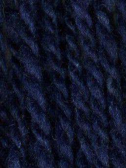 Close up on a dark blue tweed ball of Queensland Kathmandu Aran yarn. 