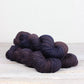 3 skeins of purple brown Fibre Co. Acadia yarn. 