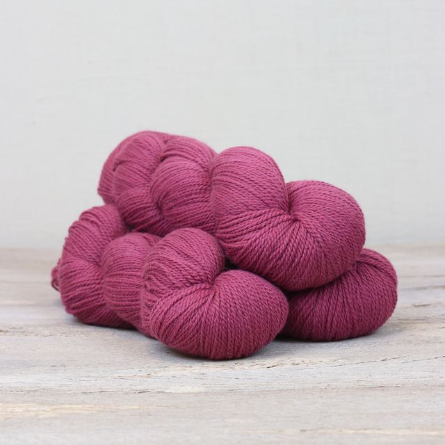 3 skeins of raspberry pink Fibre Co. Amble yarn. 