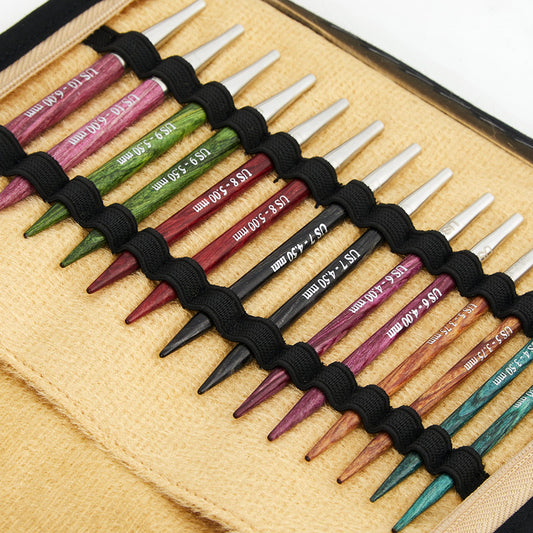 Unzipped clear plastic case of colorful interchangeable knitting needles. 