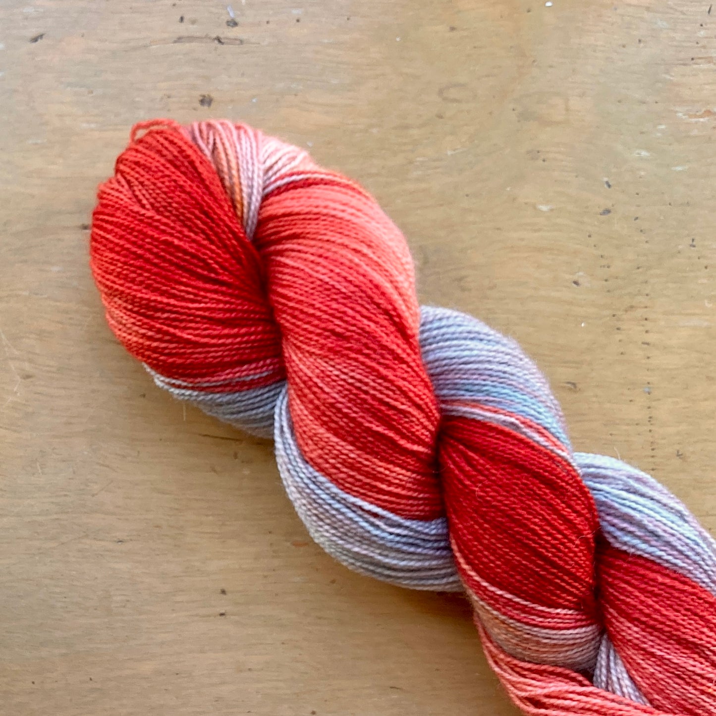 Variegated poppy red and gray Fleece Artist / Hand Maiden yarn, colorway Tiger Lily