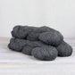 3 skeins of charcoal gray Fibre Co. Cumbria Fingering yarn. 