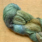 Variegated moss green skein of Hand Maiden Superkid Silk yarn, Sea Oak colorway