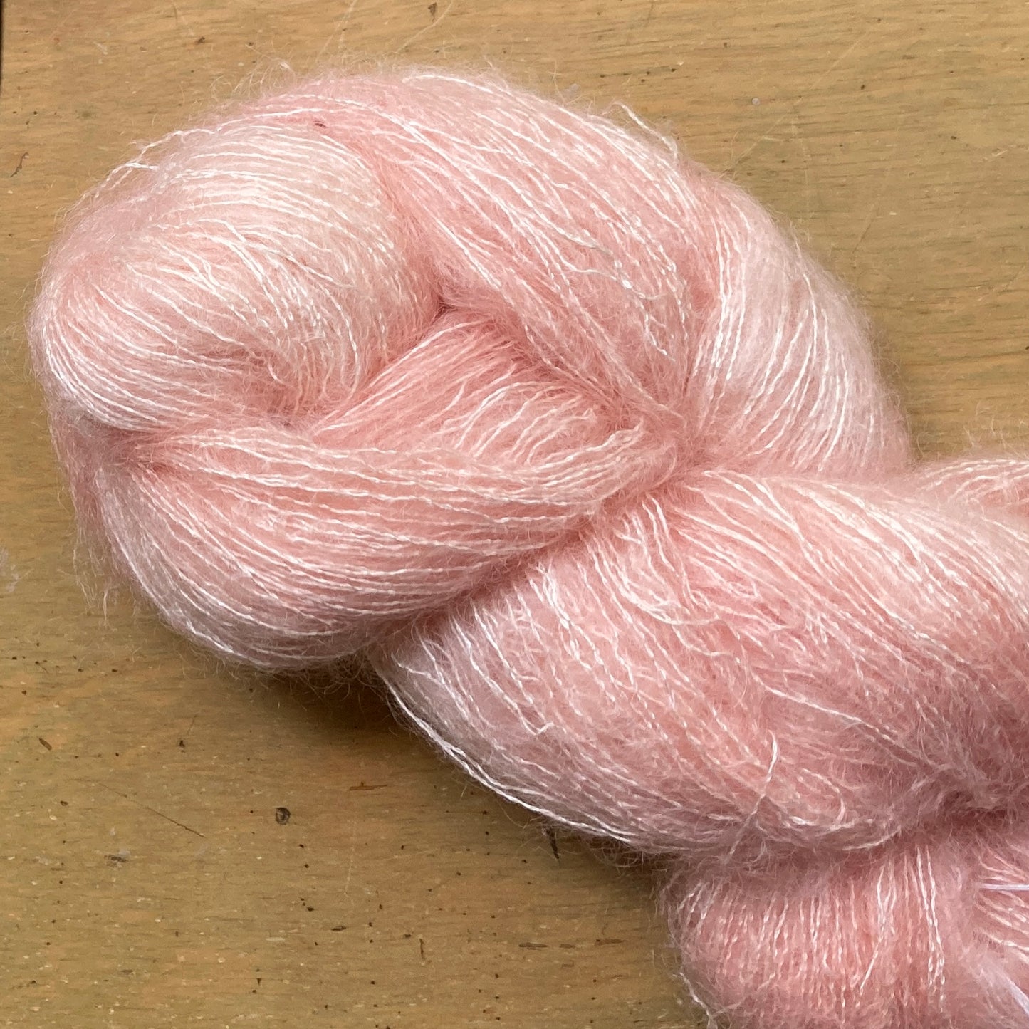 Pale coral skein of Hand Maiden Superkid Silk yarn, Shell Pink colorway