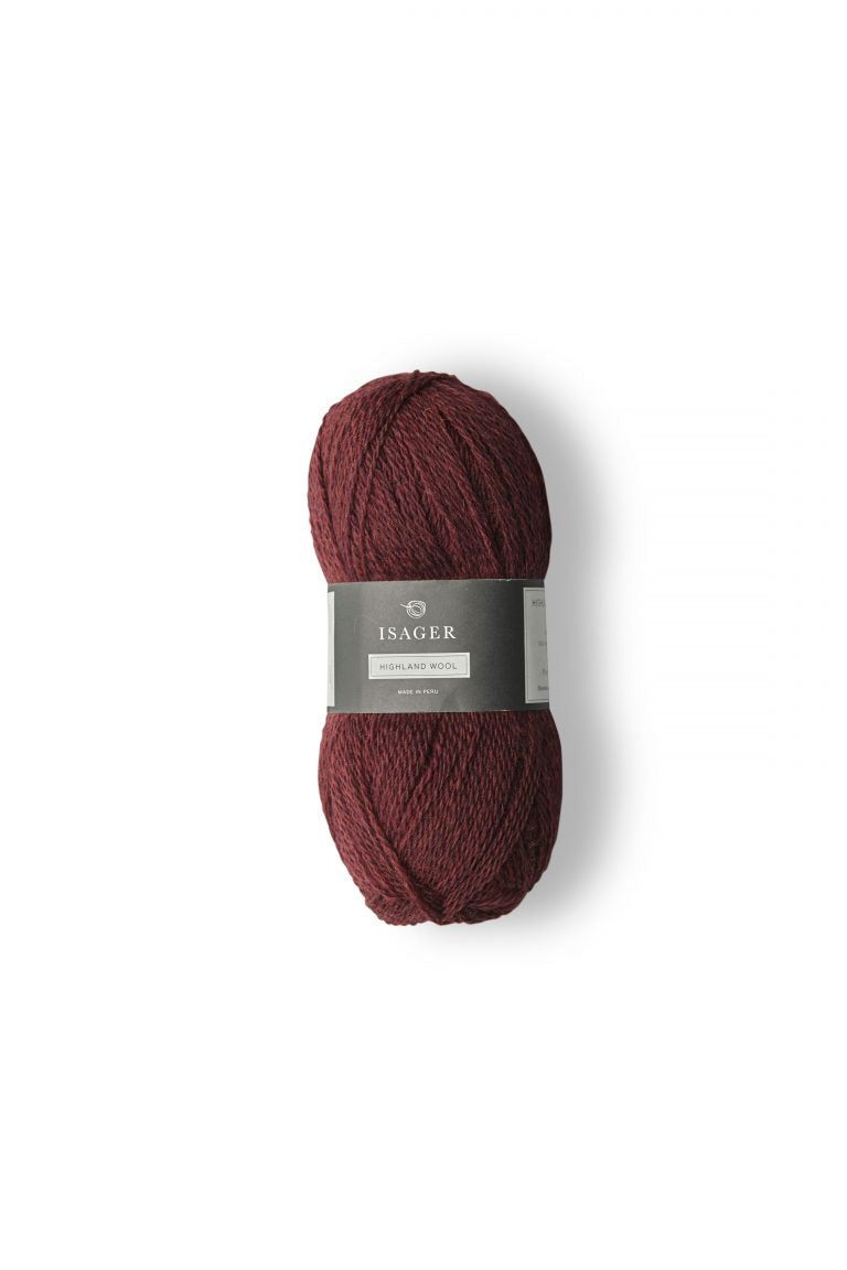 Burgundy ball of Isager Highland Wool yarn. 