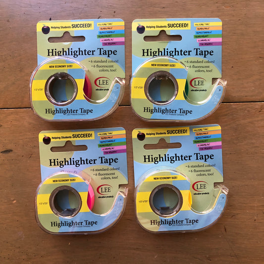 Image of four highlighter tape units in various fluorescent colors