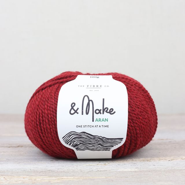 Cherry red ball of Fibre Co. & Make Aran yarn. 