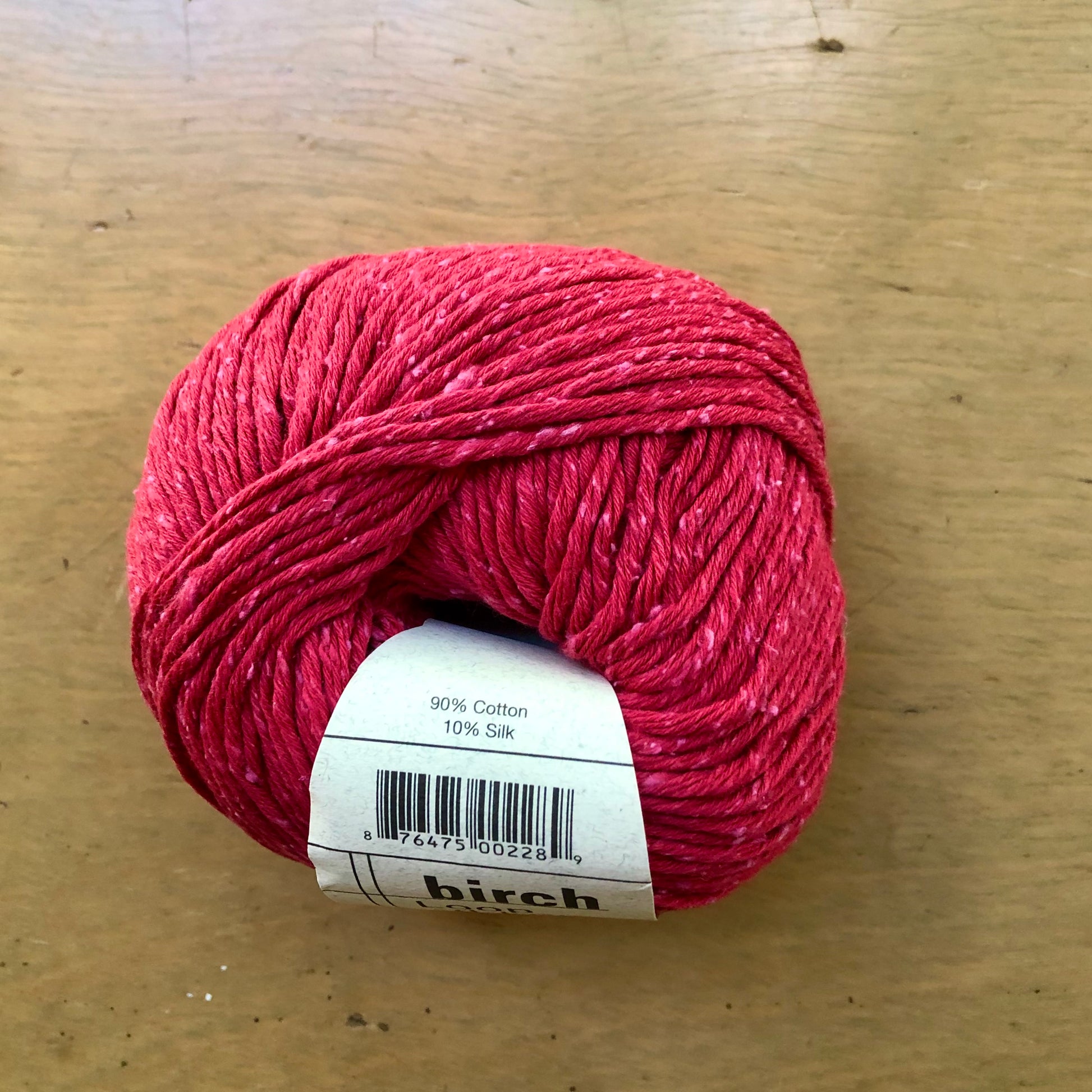 Red ball of Birch yarn, from Loop-d-Loop by Teva Durham. 