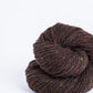 Brown tweed ball of Brooklyn Tweed Loft yarn. 