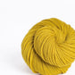 Skein of yellow Brooklyn Tweed Arbor yarn in color Tincture - Hillsborough Yarn Shop - Hillsborough, NC, USA