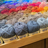 Jamieson's Shetland Spindrift yarn displayed in various colors for sale at Hillsborough Yarn Shop, NC, USA.