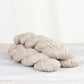 3 skeins of natural white Fibre Co. Acadia yarn. 