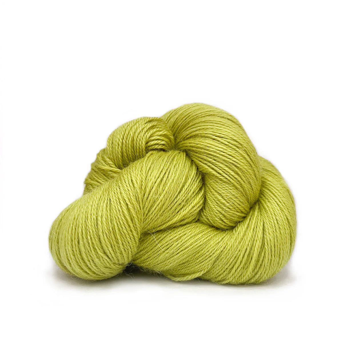 Close-up of a skein of chartreuse green Perennial yarn by Kelbourne Woolens.