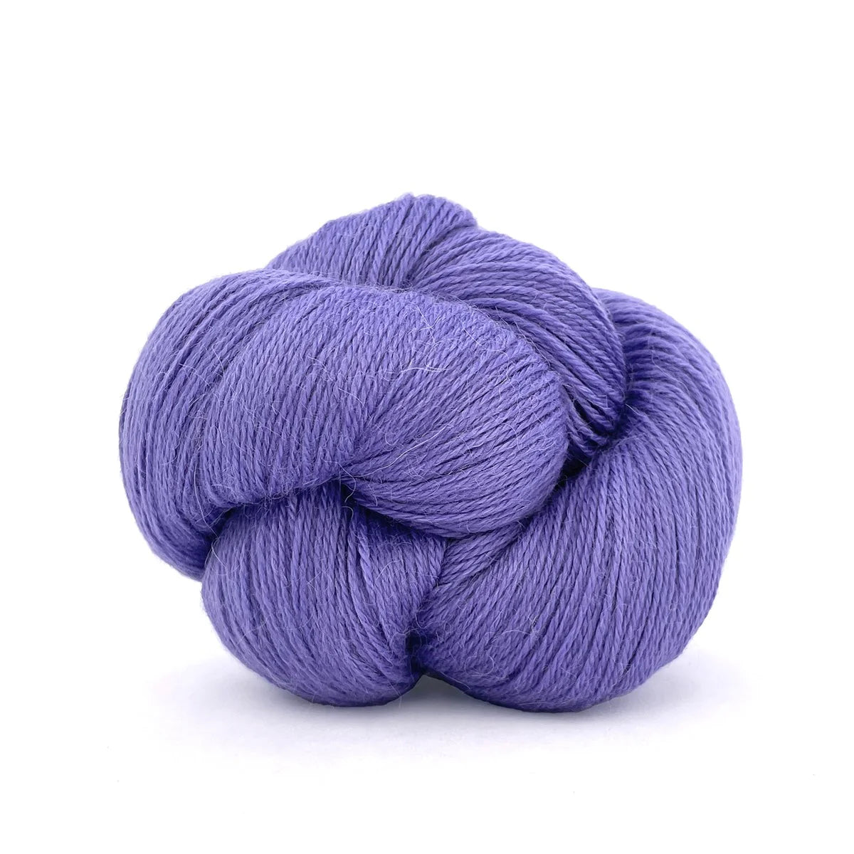 Close-up of a skein of lavender/blue Perennial yarn by Kelbourne Woolens in color Cornflower.