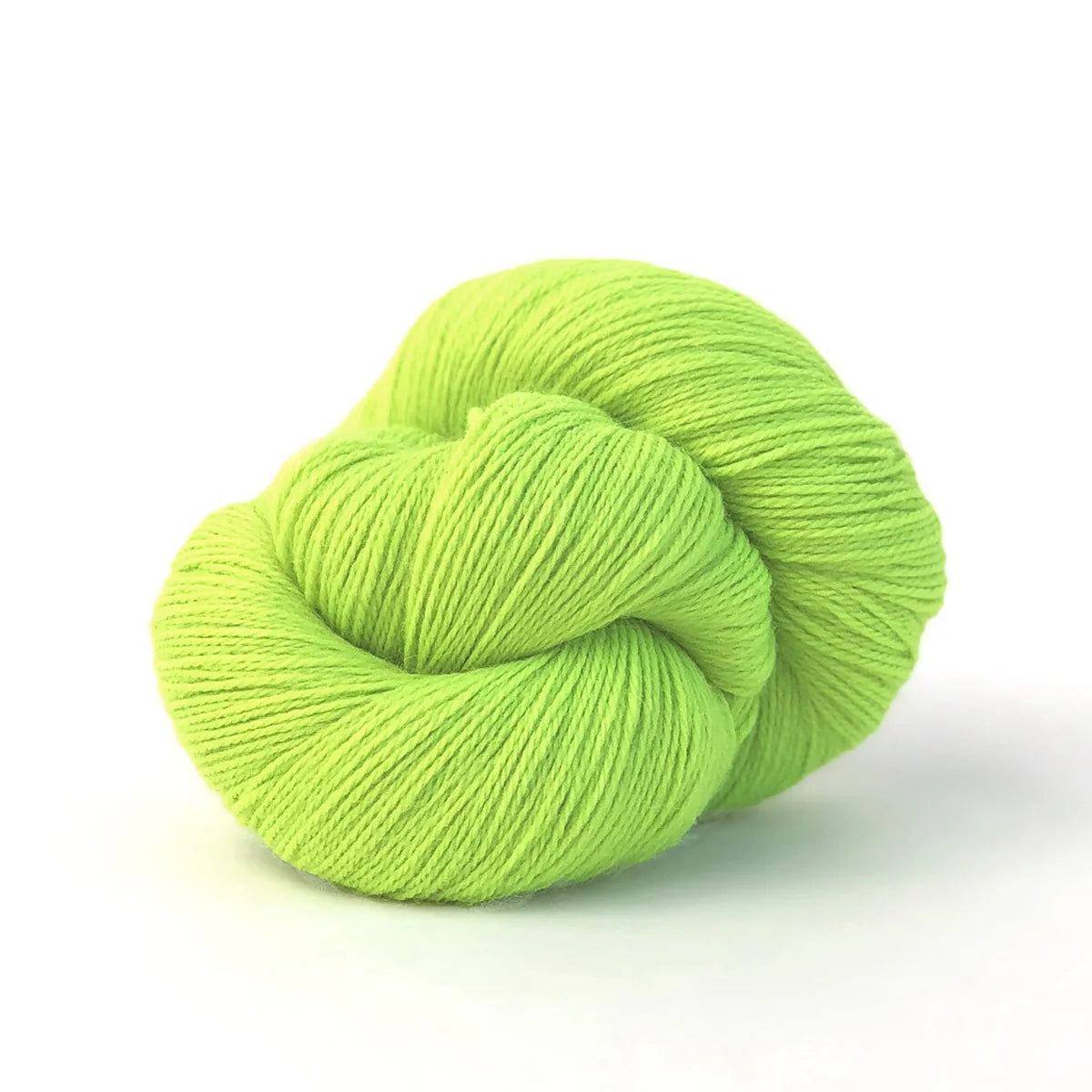 Close-up of a skein of neon green Perennial yarn by Kelbourne Woolens in color Neon Lime.