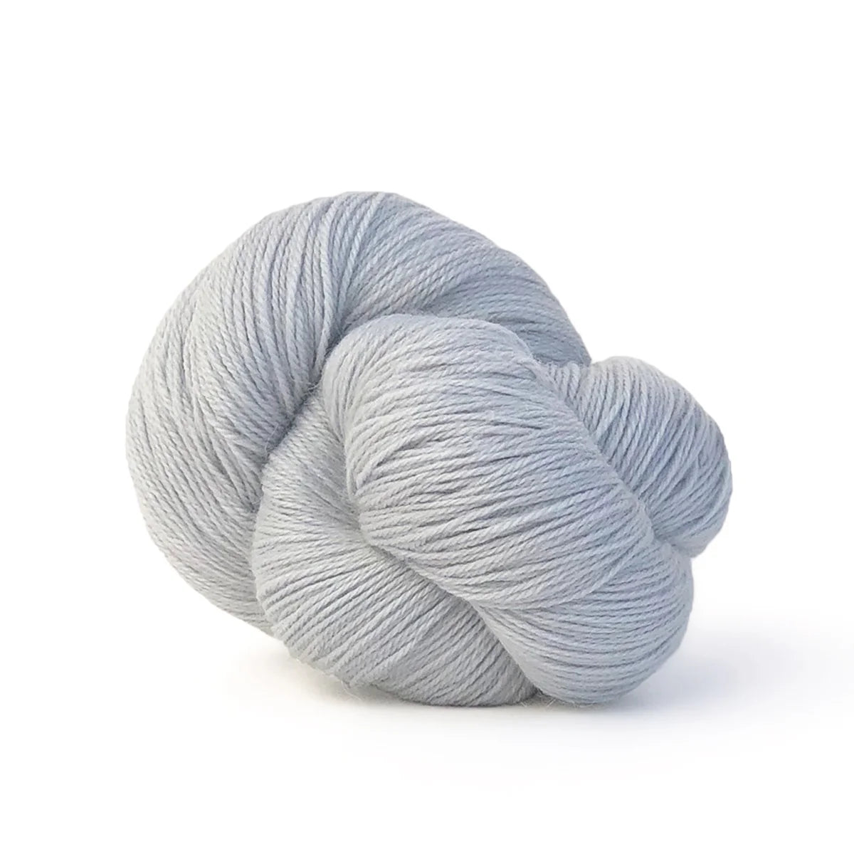 Close-up of a skein of silvery blue Perennial yarn by Kelbourne Woolens in color Silver.