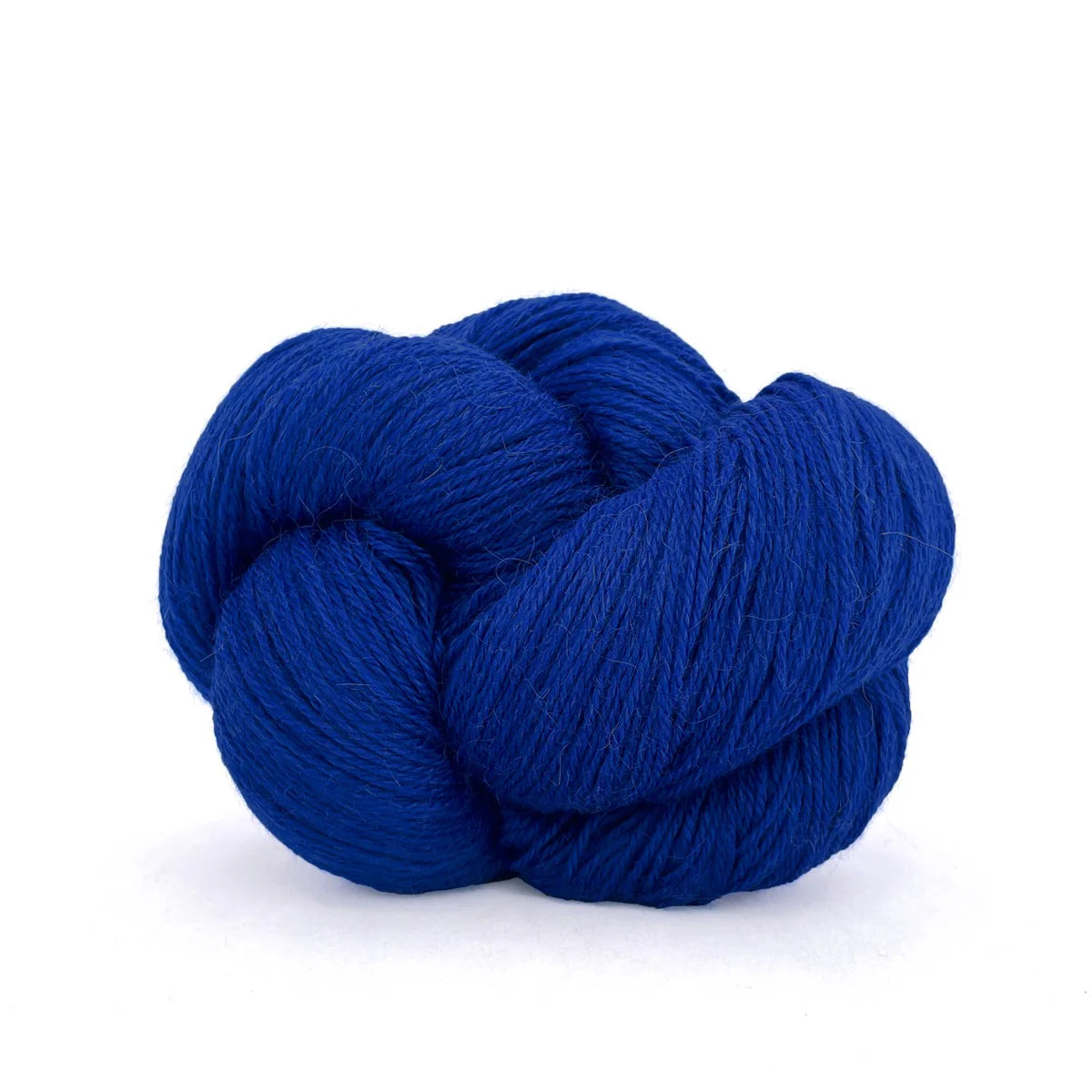 Close-up of a skein of bright blue Perennial yarn by Kelbourne Woolens in color Ultramarine.